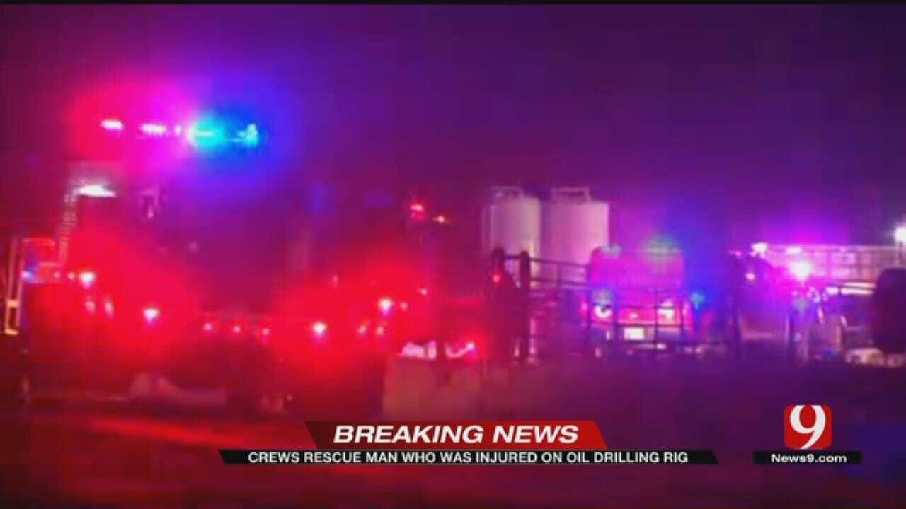 Firefighters pull worker from oil rig