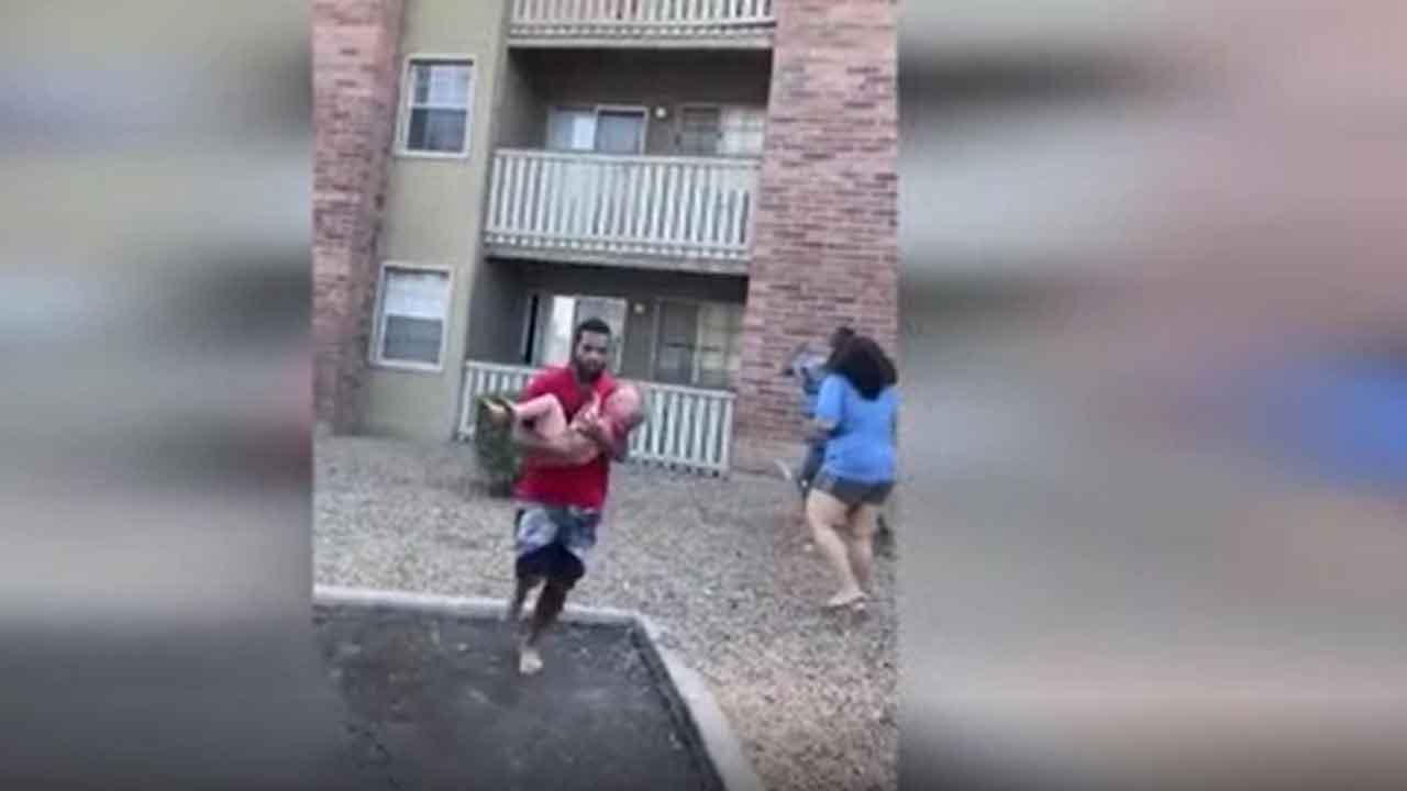 US Marine Catches Child Dropped From Burning Building
