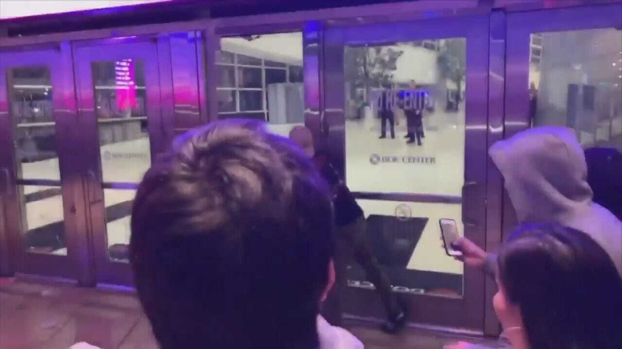 WATCH: Frustrated Travis Scott Fans Pound On Doors After Concert Postponed