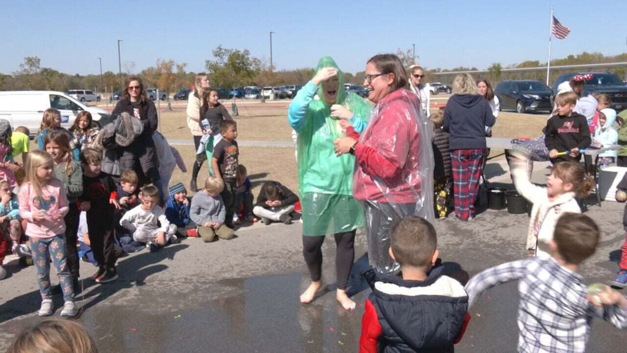 Bixby Principals, Teachers Pay Up After Students Exceed Fundraising Goal