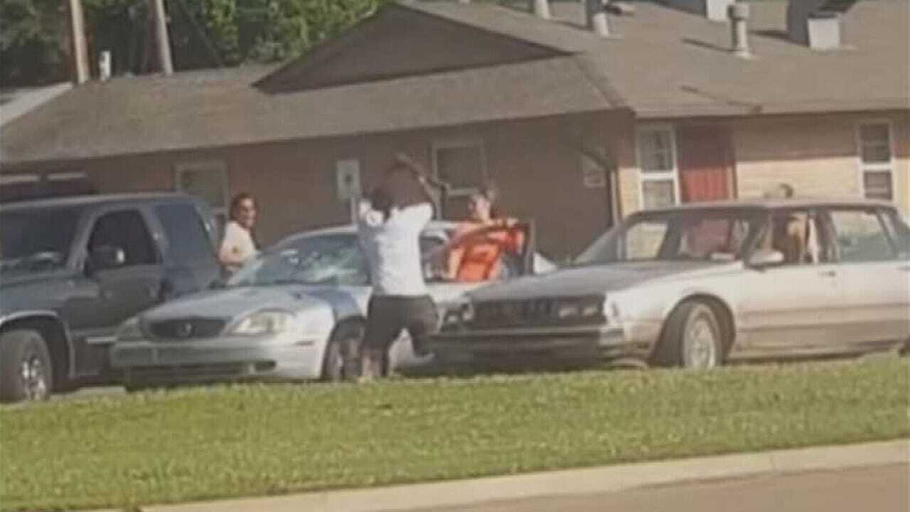 Cell Phone Video Of Man Hitting Cars With Ax