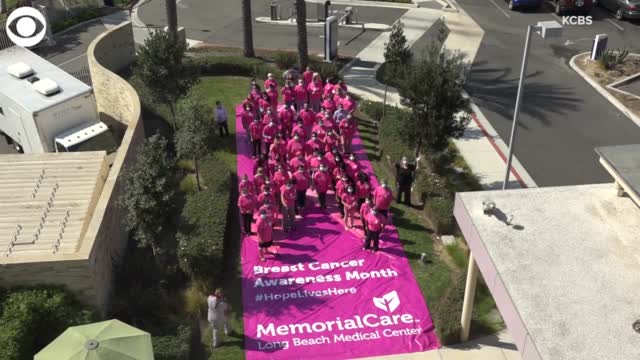WATCH: Health Care Workers Form Human Pink Ribbon For Breast Cancer Awareness