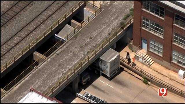 WEB EXTRA: SkyNews 9 Flies Over Semi Stuck Under Downtown Railroad Bridge