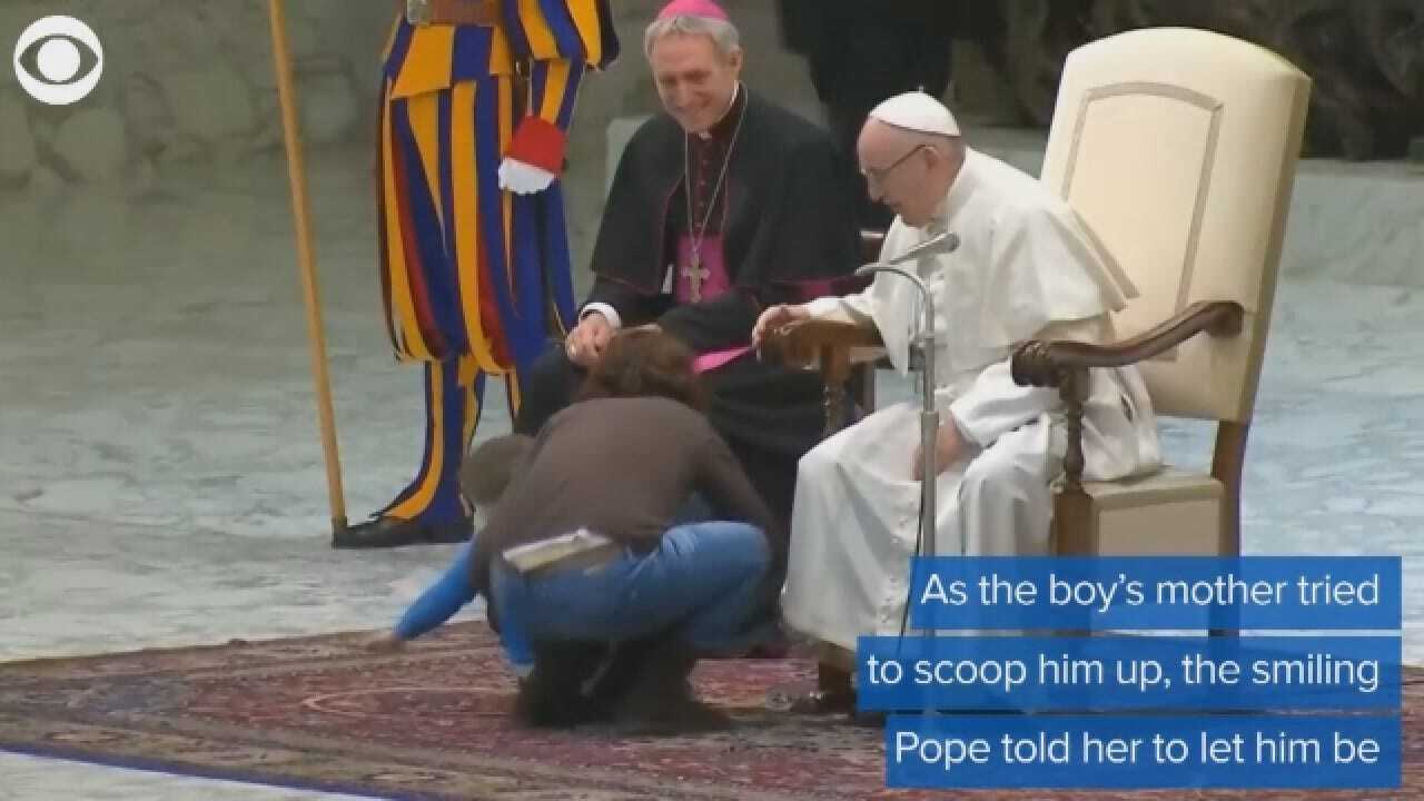 Boy Climbs On Stage With The Pope