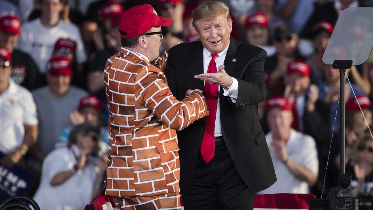 President Trump Invites Man In Wall Suit On Stage