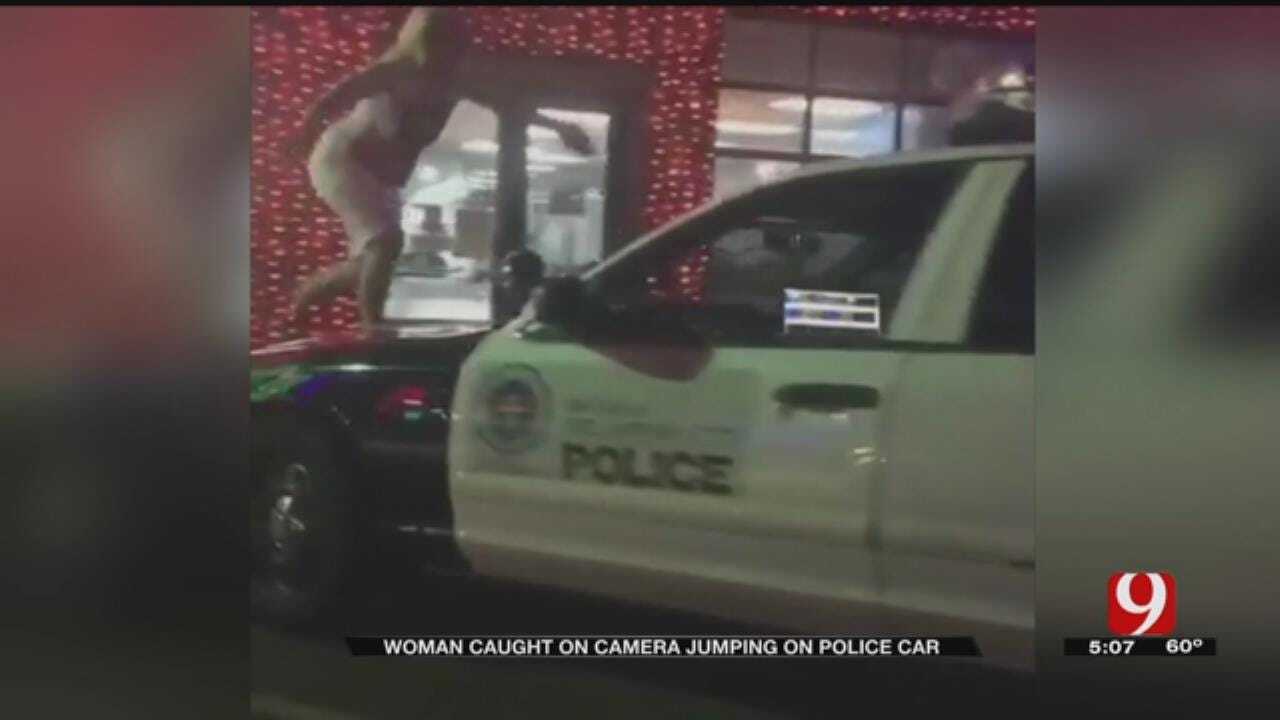 Woman Caught On Video Jumping On OKC Police Unit