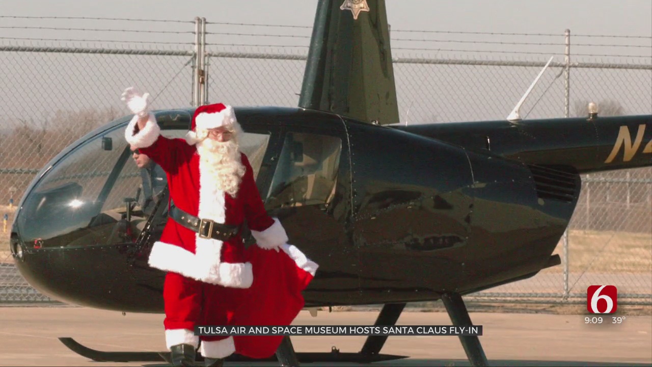 Santa Surprises Kids At Tulsa Air And Space Museum