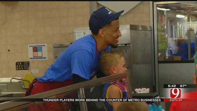 Thunder Players Work Behind The Counter Of Metro Business