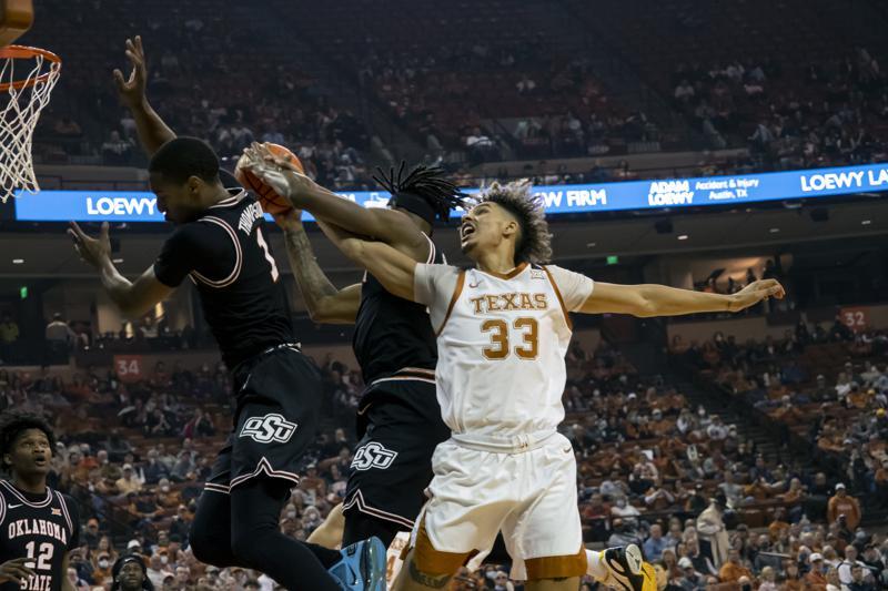 Carr Leads No. 23 Texas Past Oklahoma State 56-51