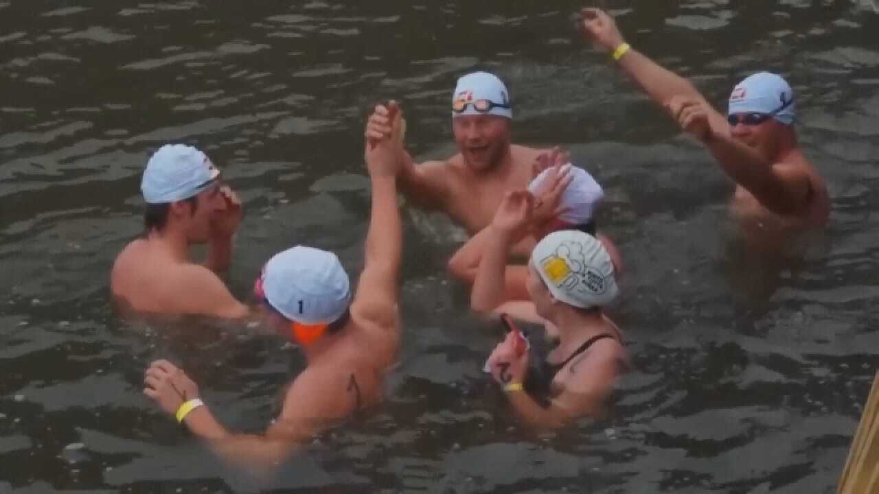 400 Swimmers Take Plunge Into River