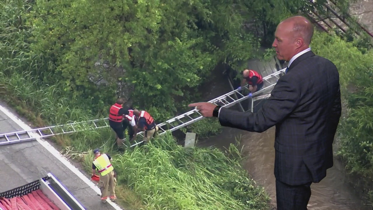 WATCH: Firefighters Rescue Man After SUV Crashes Into Creek
