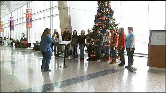 Green Country Carolers Soothe Weary Travelers At Tulsa International Airport