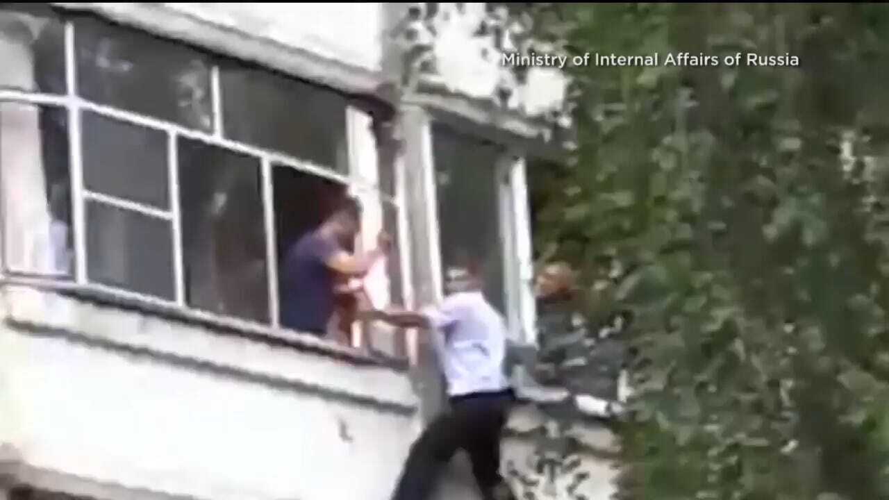 Police Officer Rescues Baby From Being Thrown From Window