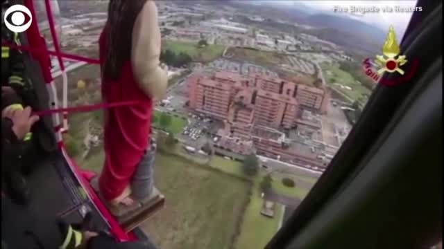 WATCH: Firefighters Fly Saint Over Italian Town