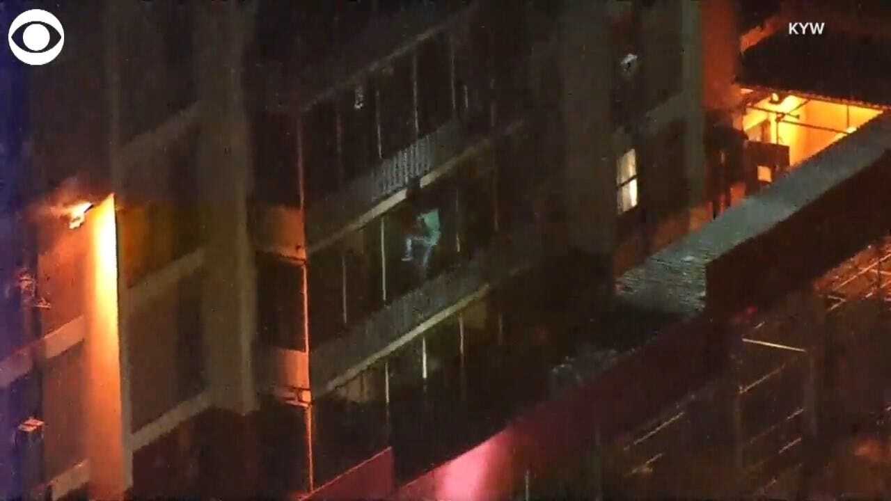Man Climbs Down Building To Escape Fire