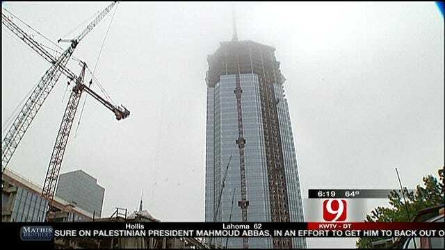 Construction Workers Top Off Devon Tower