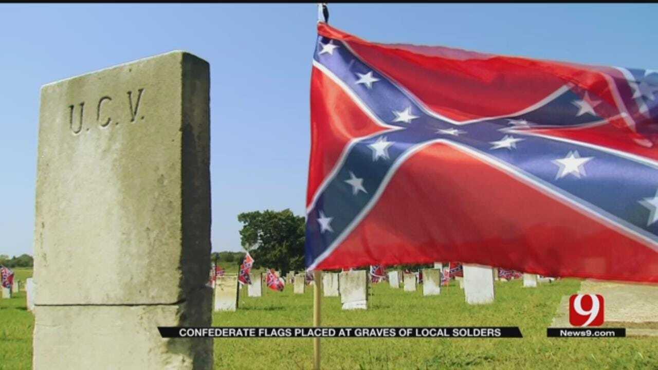 Woman Planting Confederate Flags At Ardmore Cemetery