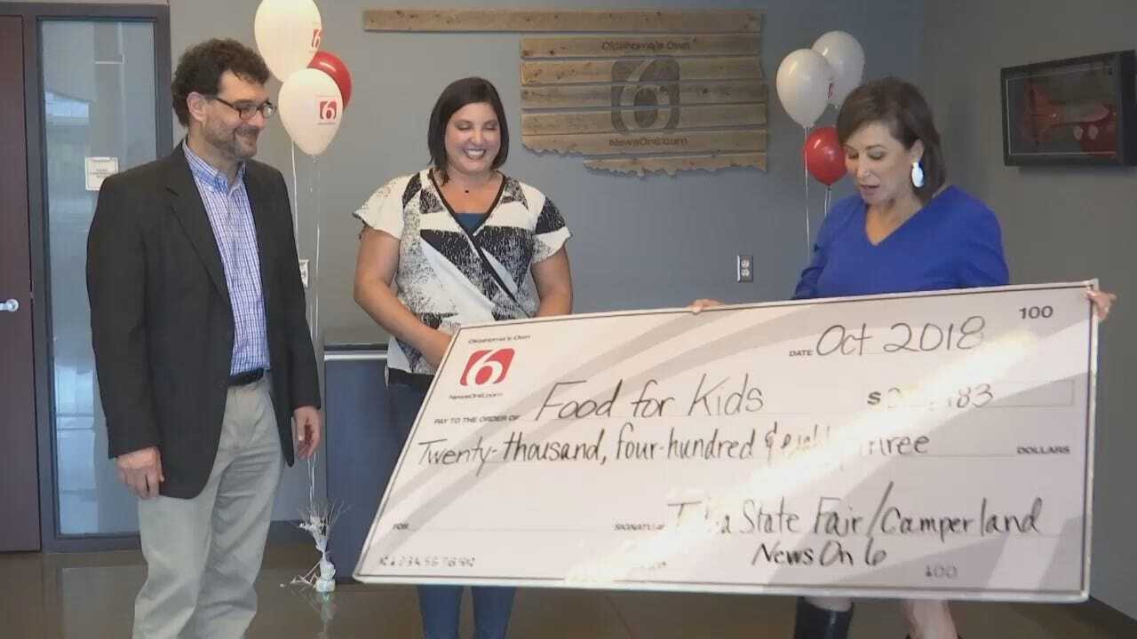 WEB EXTRA: News On 6 Presents Community Food Bank With $20,483
