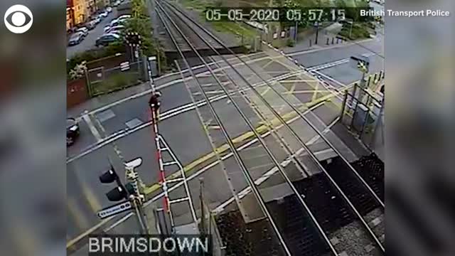 WATCH: Train Narrowly Misses Man Who Forced His Way Through Crossing Gates
