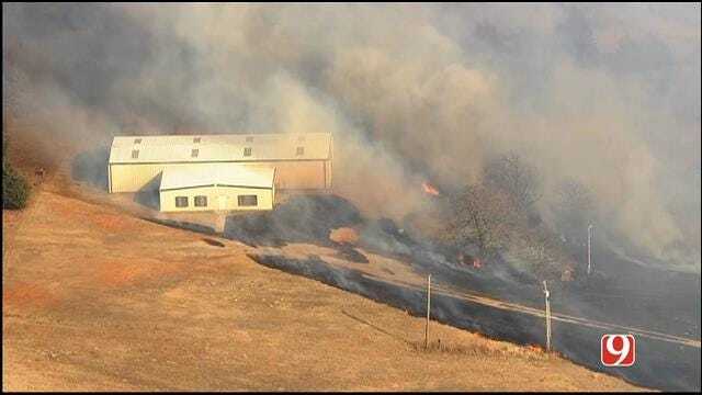 WEB EXTRA: Large Grass Fire Threatens Building, Horse Corral Near Blanchard