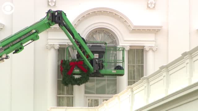 WATCH: Crews Hang Wreaths On The White House