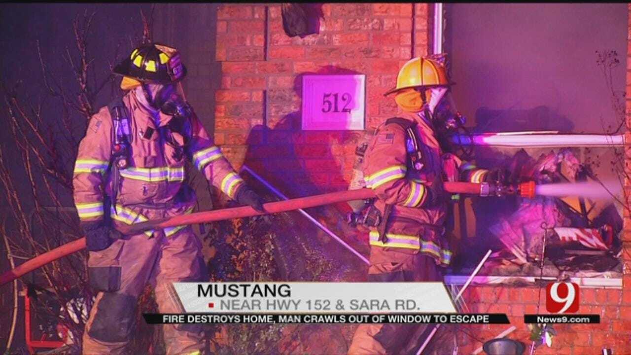 Man Crawls Out Of Window To Escape Mustang House Fire