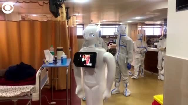 WATCH: Robot Helps COVID-19 Patients Communicate With Loved Ones