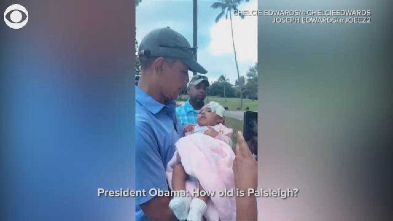 Former President Obama Gives Baby A Kiss