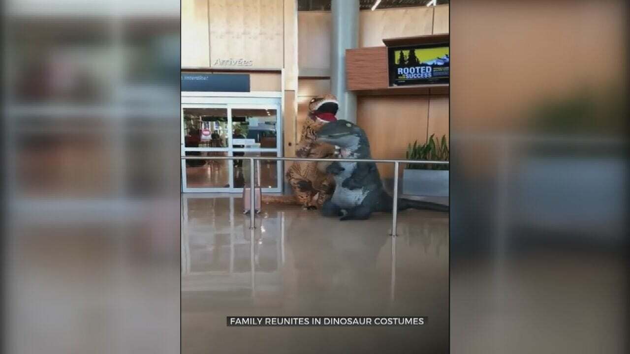 WATCH: Family Greets Grandmother In Dino Costumes At Airport