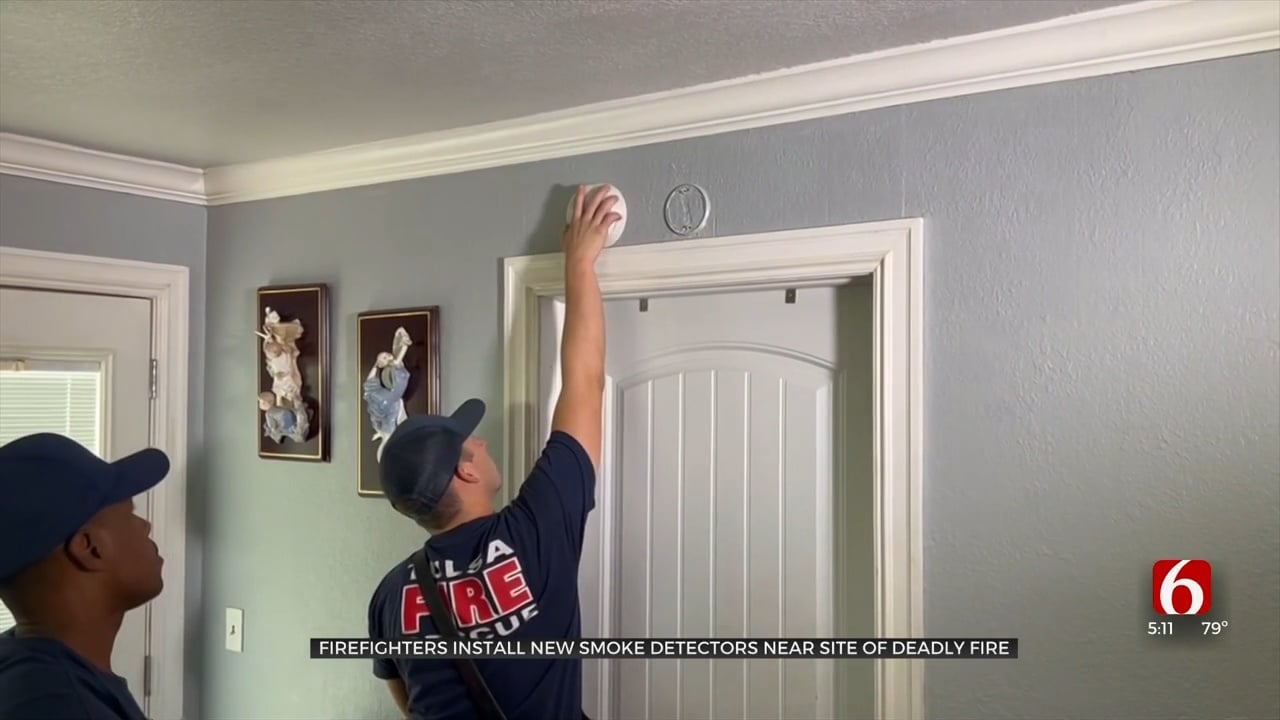Firefighters Install New Smoke Detectors Near Site Of Deadly Fire
