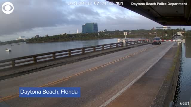 WATCH: Driver Runs Through Traffic Arm, Jumps Bridge In Florida