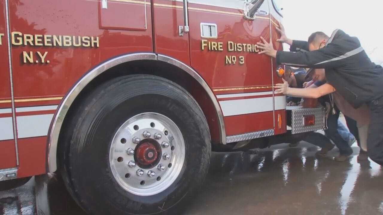 WEB EXTRA: Mounds Firefighters Push New Fire Truck Into Station