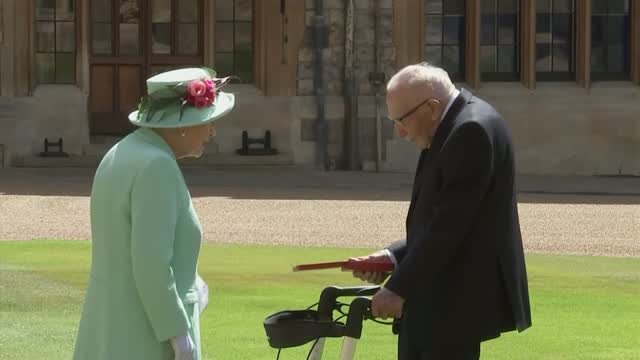 Queen Elizabeth Knights 100-Year-Old 'National Treasure' Captain Tom Moore