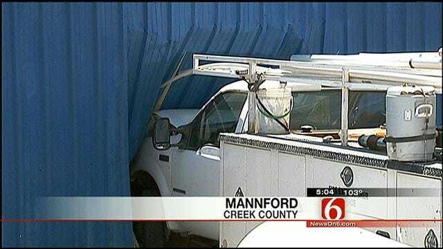 Pickup Hauling Backhoe Crashes Into Mannford Auto Parts Store