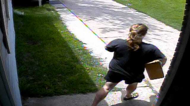 WEB EXTRA: Surveillance Video Showing Woman Taking Package Off Porch