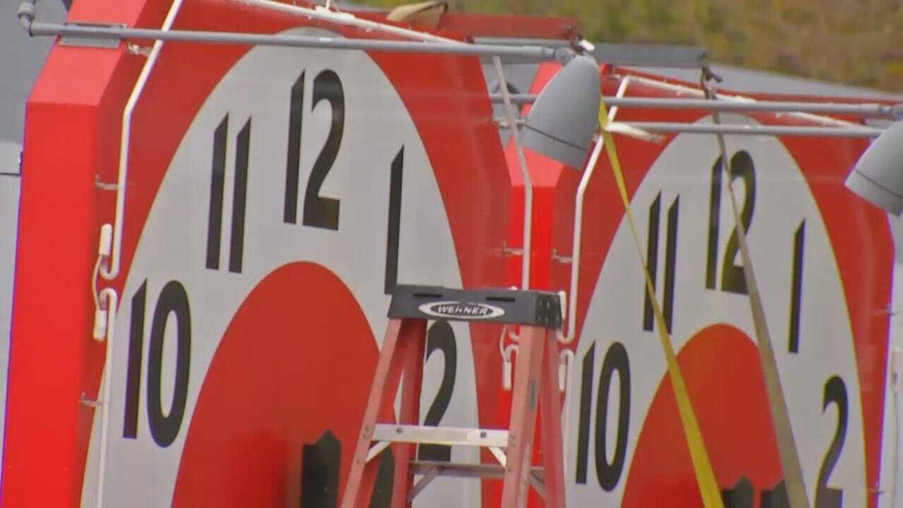 WEB EXTRA: Workers Restoring Clocks To Meadow Gold Milk Sign