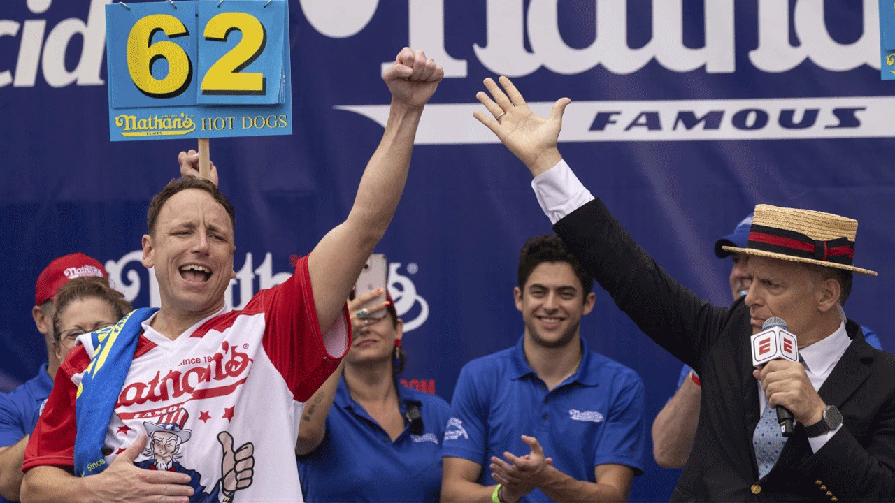 Joey Chestnut Shakes Off Rain Delay And Defends Title At Nathan’s Fourth Of July Hot Dog Contest